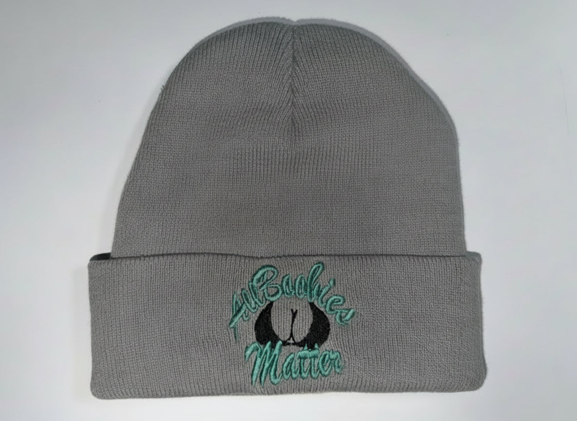 Gray beanie with embroidered text on a light gray background
