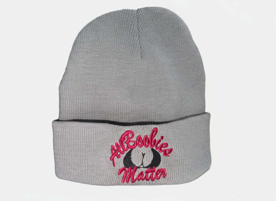 Gray beanie with 'All Boobies Matter' text on a white surface